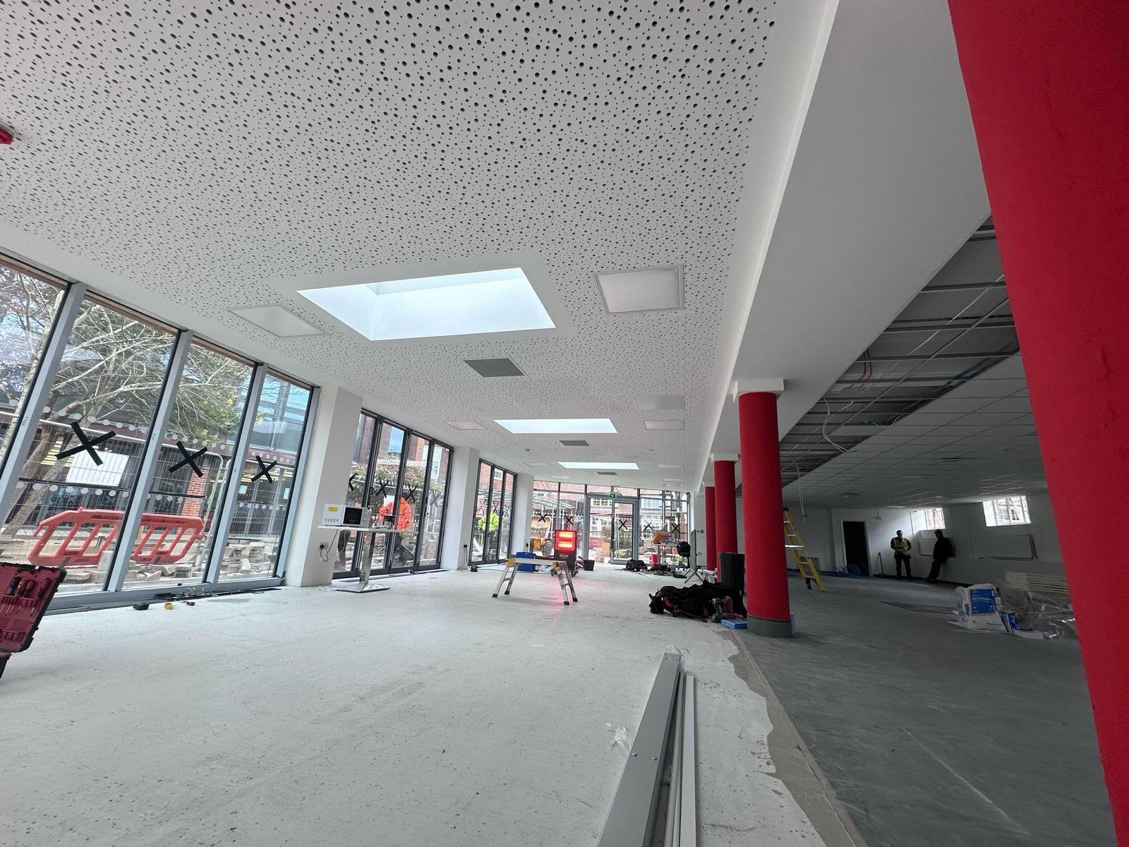 Drywall partitions being installed inside a commercial building